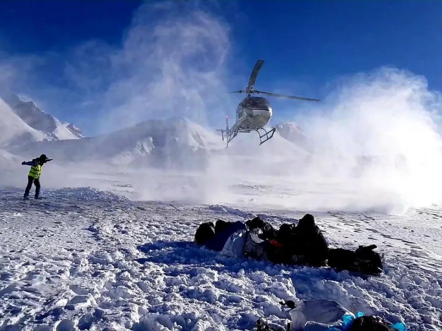 Person enjoying in kalapthar while helicopter lands.